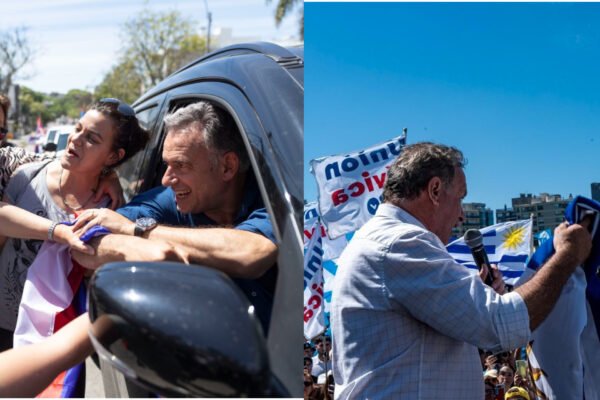 De un lado Orsi extiende su brazo para saludar desde el auto. Del otro, Delgado se dirige a la multitud